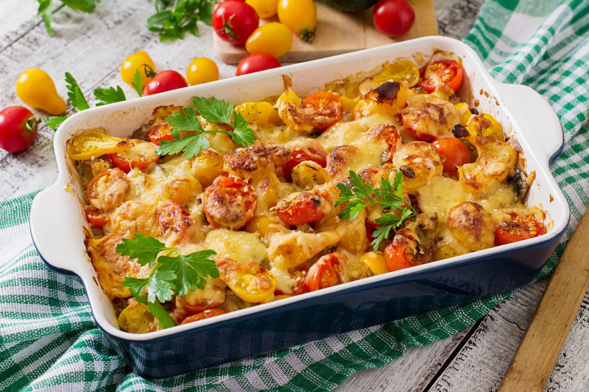 A delicious ground turkey casserole baked to golden perfection, topped with melted cheese and garnished with fresh herbs, served in a colorful dish on a wooden table.