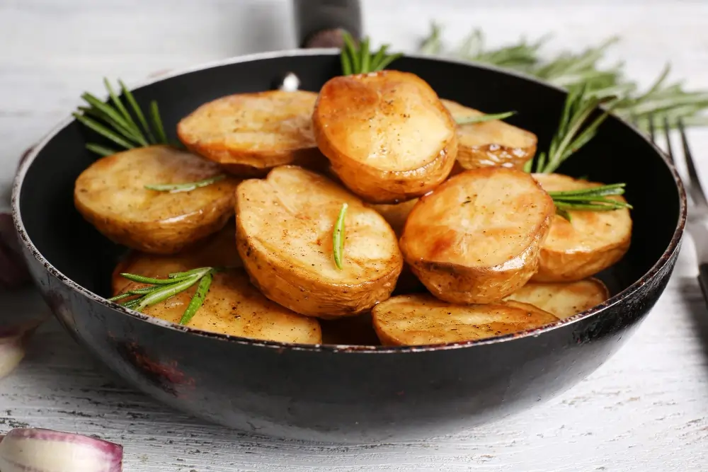 Delicious Caramelized Potatoes and Onions Danish served on a plate, showcasing golden flaky pastry and rich caramelized vegetable filling