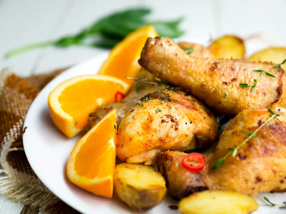 Lemon Pepper Chicken Thighs: A beautifully plated dish of lemon pepper chicken thighs, garnished with fresh herbs and lemon slices, showcasing a vibrant and appetizing meal.