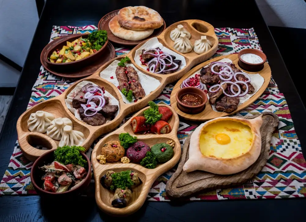 “Golden puri (fried bread) served with semolina halwa, chana masala, and aloo bhujia on a traditional platter.”